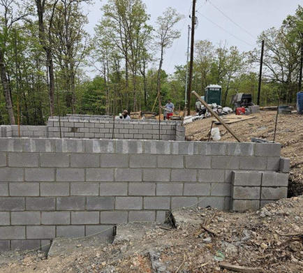 We can do the trenching for footings, concrete pouring for those footings and slabs in the Rogers area.